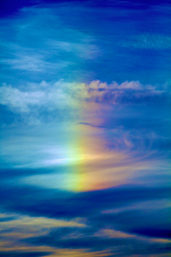 Rainbow in moody sky background