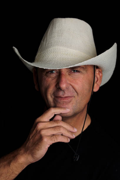istock photography man over 50 years old with hat on black background 1429416565