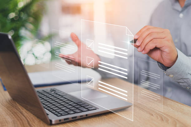 istock Electronic signature concept, business people sign electronic documents on digital in virtual screens, Businessman use laptop and hold a pen marking on electronic document paperless office 1429418081