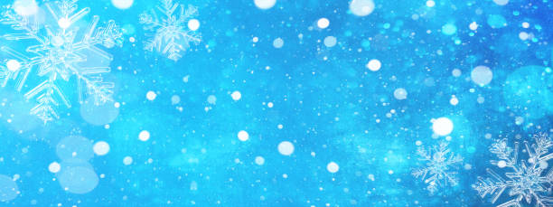 istock snowflakes and ice crystals isolated on blue sky - winter background 1429420260