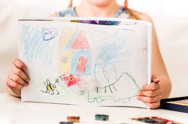 istock Girl showing pastel drawing 1429422116