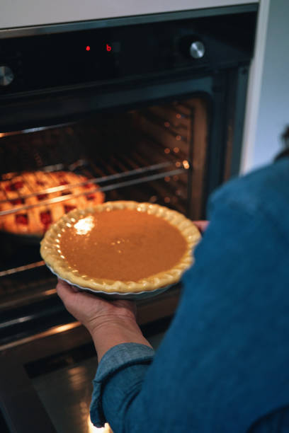 istock Baking Pumpkin Pie for the Holidays in the Oven 1429422245