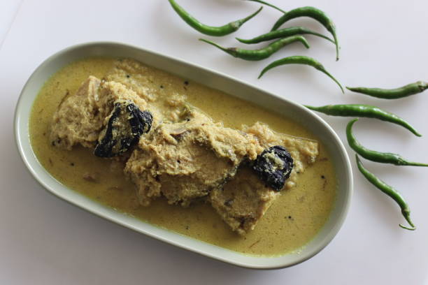 istock Kerala style, coconut based Pomfret fish curry. Yellow coloured fish curry 1429424647