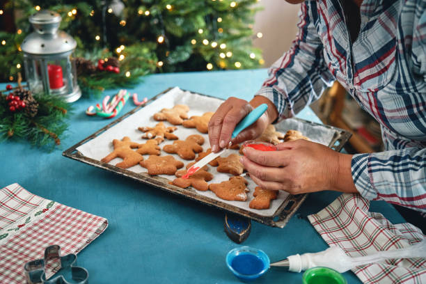 istock Decorating Gingerbread Christmas Cookies with Icing 1429425876