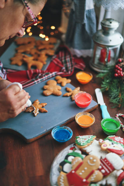 istock Decorating Gingerbread Christmas Cookies with Icing 1429425954