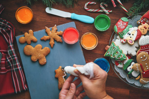 istock Decorating Gingerbread Christmas Cookies with Icing 1429425964
