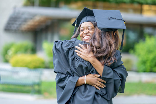 istock University Students Congratulating Each Other at Graduation 1429433347