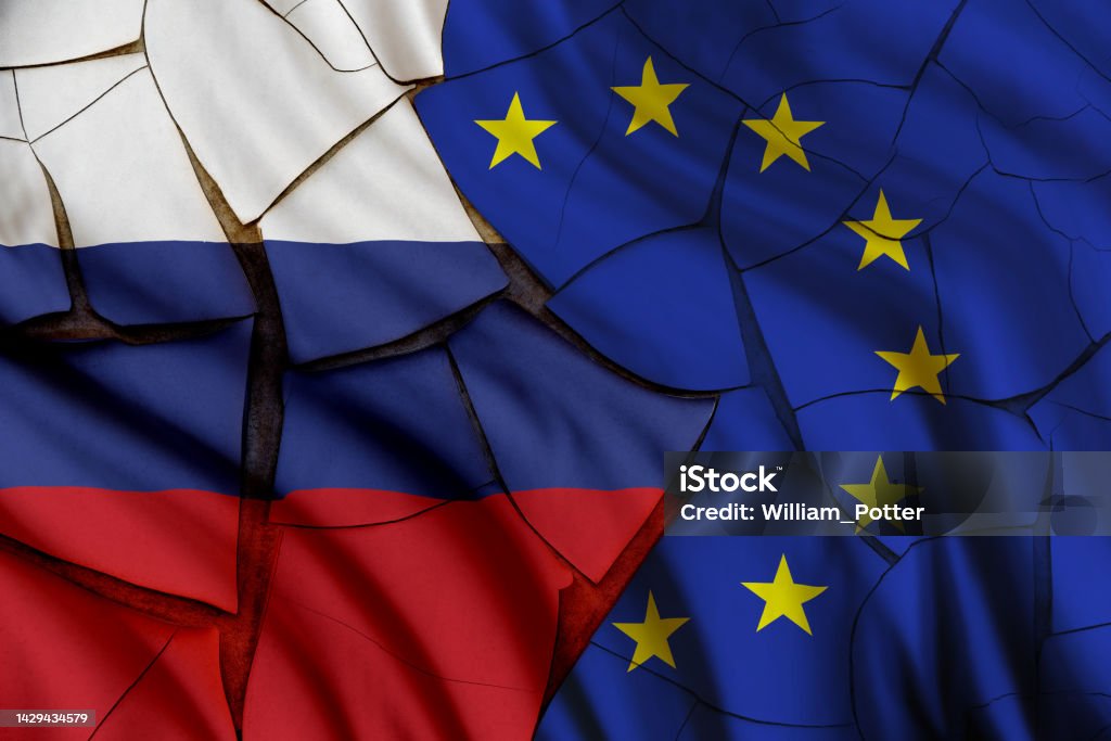 Russia vs European Union gas and oil conflict, economic concept : Russian and EU flags on a cracked wall, depicting the impact of Russia's invasion of Ukraine on the Europe and global energy market. European Union Stock Photo