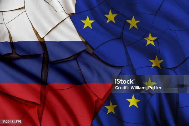 Russia Vs European Union Gas And Oil Conflict Economic Concept Russian And Eu Flags On A Cracked Wall Depicting The Impact Of Russias Invasion Of Ukraine On The Europe And Global Energy Market Stock Photo - Download Image Now