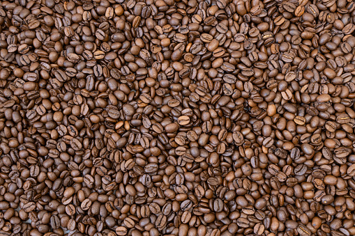 Texture of roasted coffee beans. Coffee beans