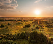 Aerial scenic landscape of forested plain at sunset