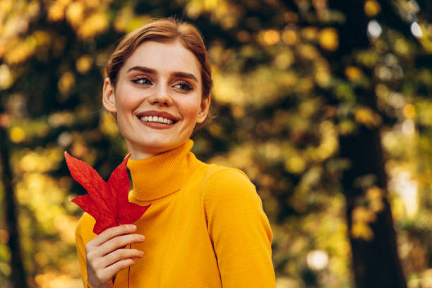 istock Beautiful woman enjoying autumn 1429449610
