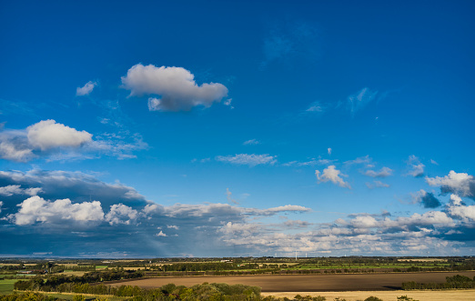 Clouds hanging over landscape seen from drone point of view