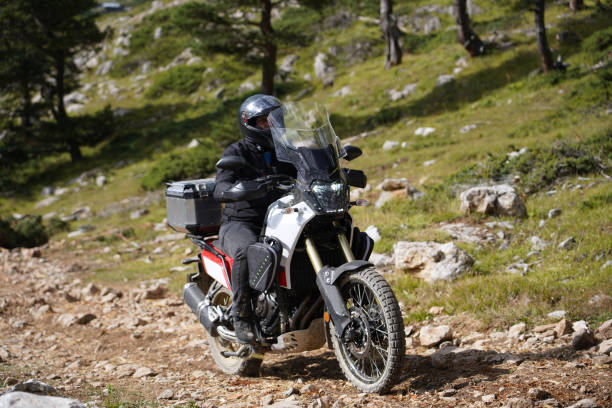 istock A man riding an off-road motorcycle on a mountain road 1429461489