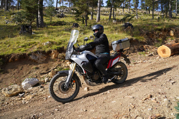 istock A man riding an off-road motorcycle on a mountain road 1429461492