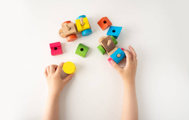 istock child playing with wooden car train 1429466317