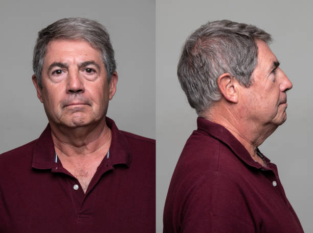 Serious Senior Man front and profile mugshots Serious  senior man front and profile mugshots on gray background id photo stock pictures, royalty-free photos & images