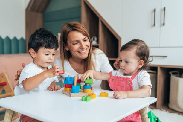 istock Mother playing with toddlers 1429477564