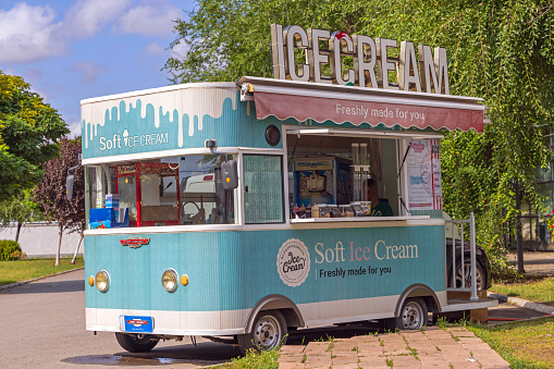 Simanovci, Serbia - August 22, 2022: Mobile Soft Milk Ice Cream Vehicle at Town Park.
