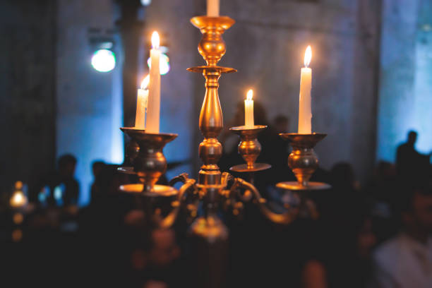 Vintage retro brass candlesticks with candles burning