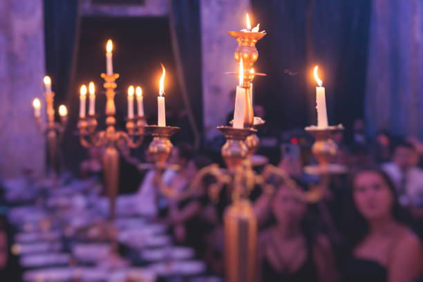 istock Vintage retro brass candlesticks with candles burning 1429485389
