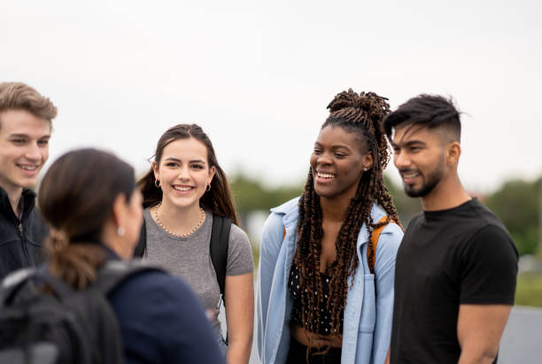 istock Friends stand outside and chat 1429487269