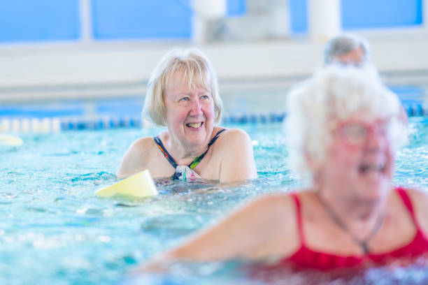 istock Seniors Lifting Weights in a Pool 1429492724