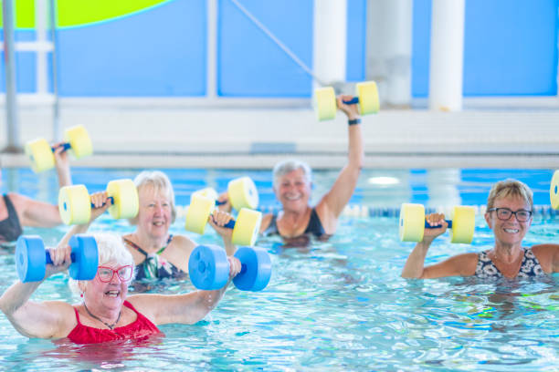 istock Seniors Lifting Weights in a Pool 1429492737