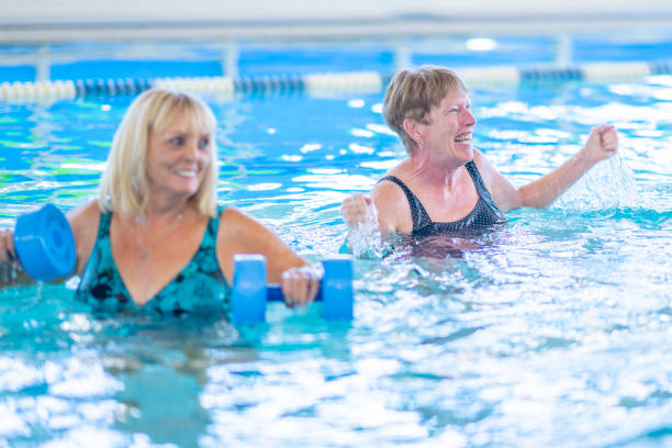 istock Seniors Lifting Weights in a Pool 1429492748