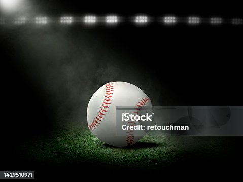 istock Baseball at night under stadium lights 1429510971