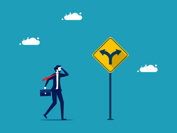 istock Career direction or business direction. Businessman making decisions on a direction arrow sign 1429520656