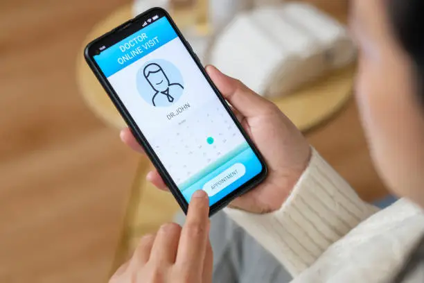 Photo of appointment consulting doctor visit on mobile app at home.telemedicine