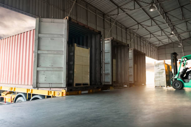 istock Trailer Contaner Trucks Parked Loading at Dock Warehouse. Shipping Cargo Container Delivery Trucks. Distribution Warehouse. Freight Trucks Cargo Transport. Warehouse Logistics. 1429541202