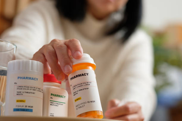 asian woman taking pill when get sick at home