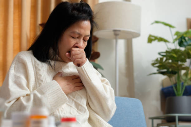 asian woman get flu and cough sick at home stock photo