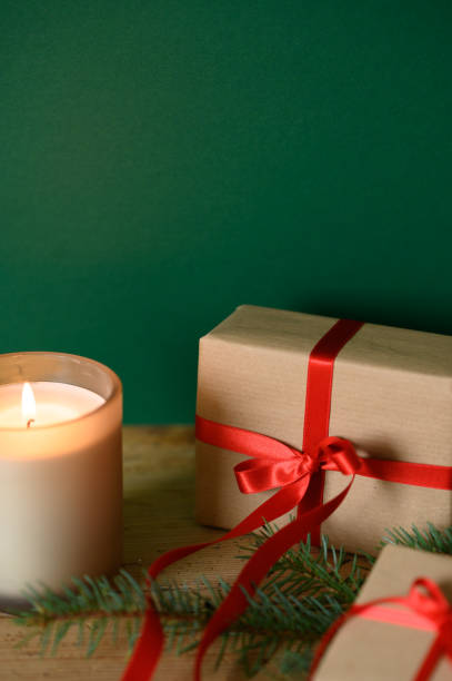 istock Close up of Christmas gift box with candle light 1429547651