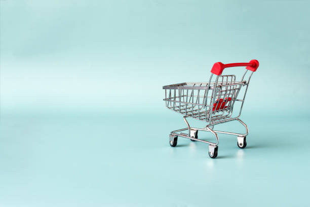 istock An empty grocery basket from a supermarket on a blue background is a place for text. The concept of business, sales and retail. 1429555103