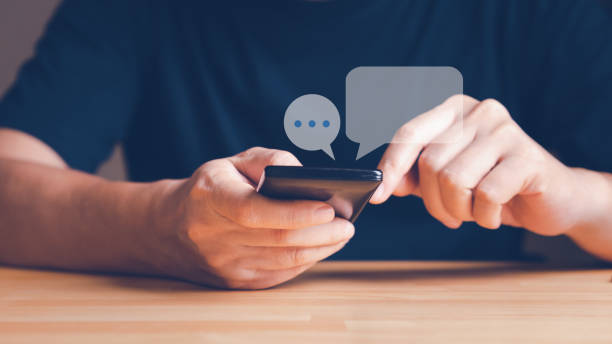 istock Hand holding smart phone for chatting or text and sending messages. 1429560407