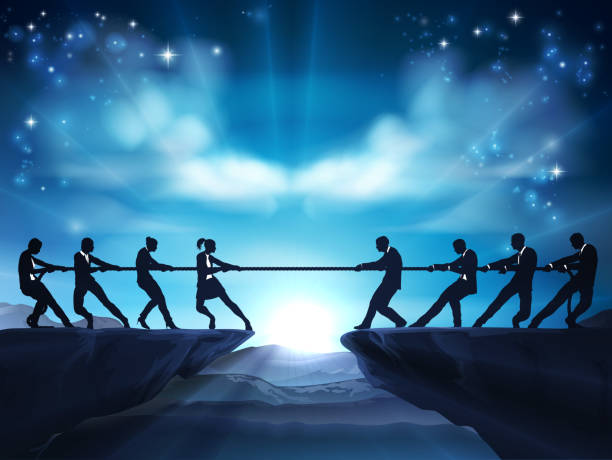 istock Tug of War Rope Pulling Silhouette Business People 1429572983