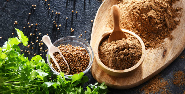 istock Ground coriander, its dried seeds and fresh leaves 1429573495