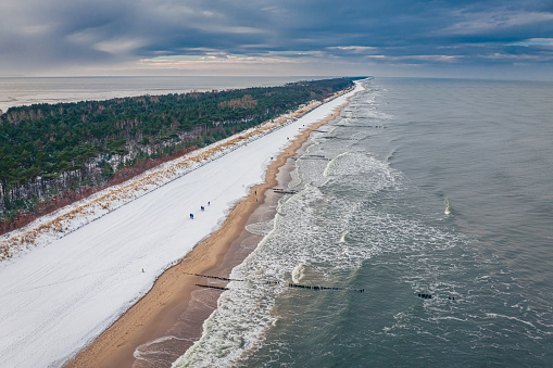 Snowy beach on Hel peninsula in winter. Winter Baltic Sea. Aerial view on winter in Poland
