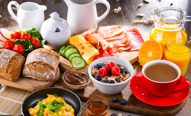 istock Breakfast served with coffee, scrambled eggs, cereals and ham 1429574831