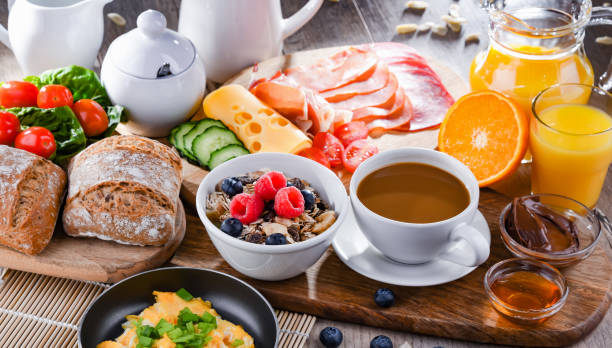 istock Breakfast served with coffee, scrambled eggs, cereals and ham 1429574936