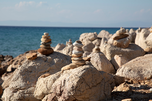 Zen garden with stack of stones in raked sand