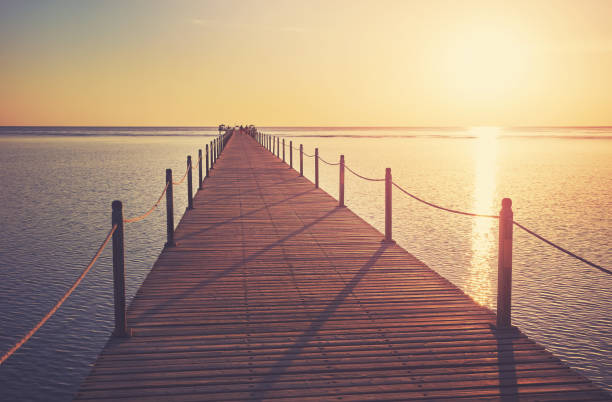 istock Wooden pier at sunrise, color toning applied, Egypt. 1429585537