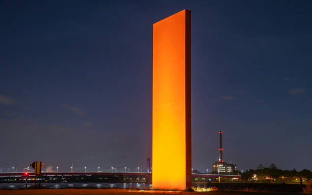 Duisburg, Germany - June 12, 2022: Rhine Orange, illuminated landmark of Ruhr Metropolis on the outlet of the Ruhr river into the Rhine river on June 12, 2022 in Duisburg, Germany