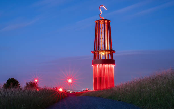 Moers, Germany - June 11, 2022: Mine lamp, illuminated landmark of Ruhr Metropolis on top of Rheinpreussen tip on June 11, 2022 in Moers, Germany