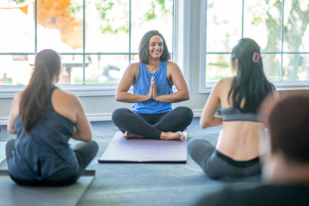 istock Woman Leading a Meditation Class 1429591688