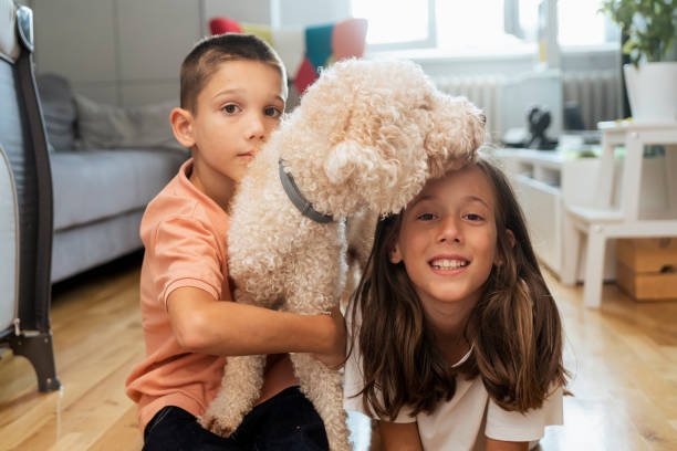 istock Happy kids with dog at home 1429594315