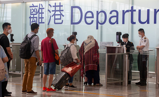 2022 Oct 02,Hong Kong.Travelers queue in the departure hall of the Hong Kong International Airport